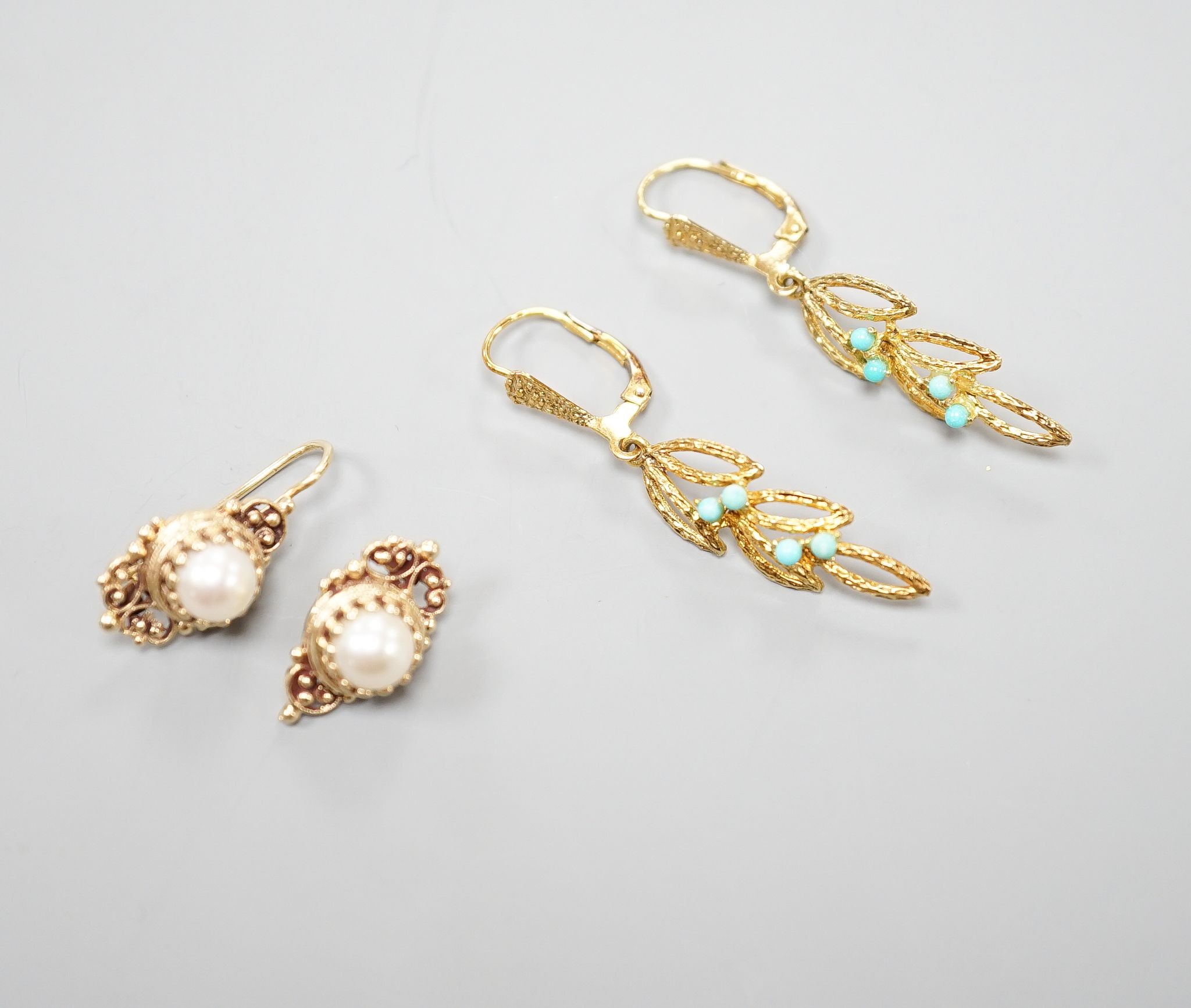 Two modern pairs of 14ct and gem set earrings, one with mabe pearl (a.f.) and one with turquoise, gross weight 7.1 grams.